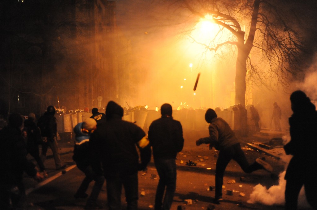 Why would anyone go against well armed and armored riot police with a piece of pipe (as here, in Kiev, on December 1)? That is the question. (Wikipedia photo)