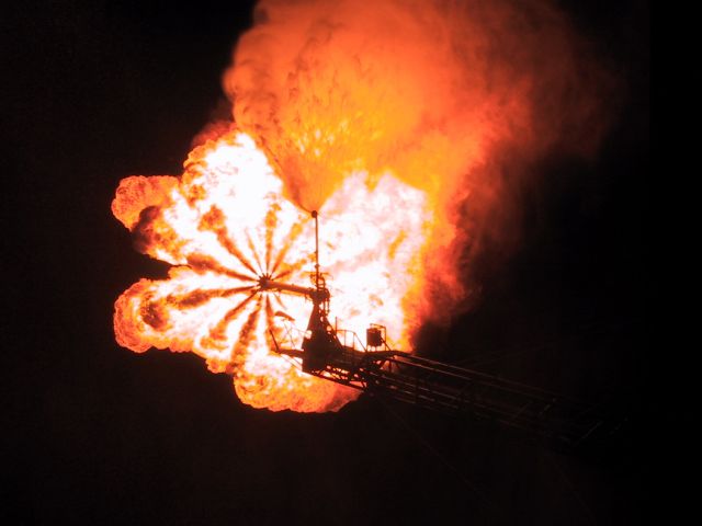 Seen from above, natural gas being flared at night bears a remarkable resemblance to the ill-fated Hindenburg. (Photo by Phudpucker.com)