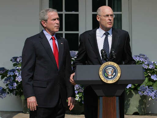 Henry Paulson (right) speaks at his nomination as Secretary of the Treasury. He lived through one crash. Now he sees another coming.