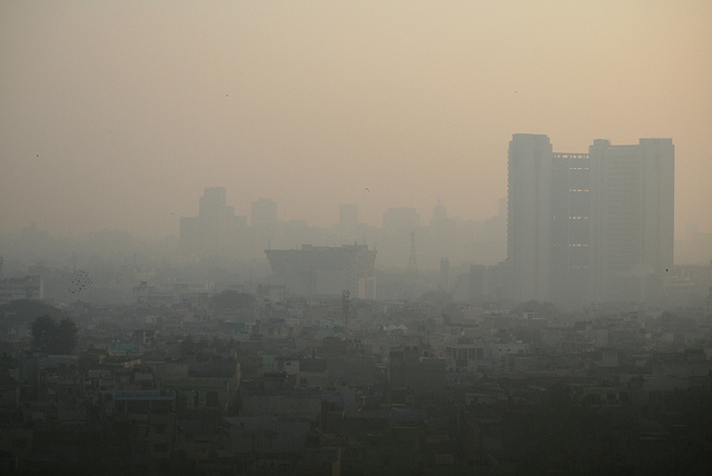 The air in Delhi, shown here in 2011, like the air in Beijing, is barely breathable by humans. Yet these two countries, with their 2.6 billion people, have just begun to burn fossil fuels. (Photo by je poirrier/Flickr) 