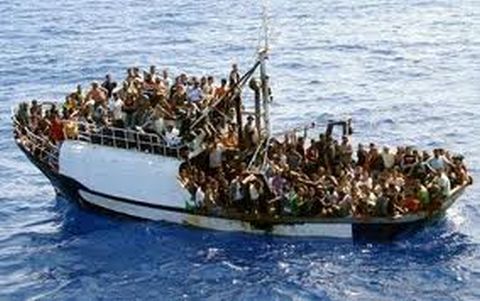 A typically overloaded boat carries Libyan refugees toward Europe. (Photo by notenoughgood.com) 