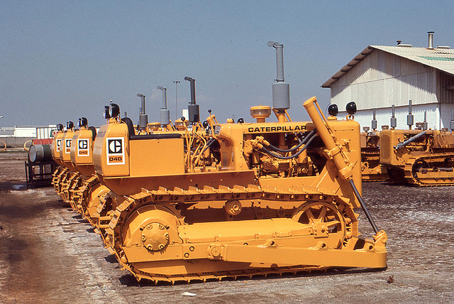 Unsold Caterpillar bulldozers lined up in Sao Paulo, Brazil. These are the caterpillars that signal what the financial winter is going to be like. (Photo by Roger W/Flickr) 